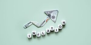 Image with 'Inflation' text and visuals illustrating rising costs and economic uncertainty