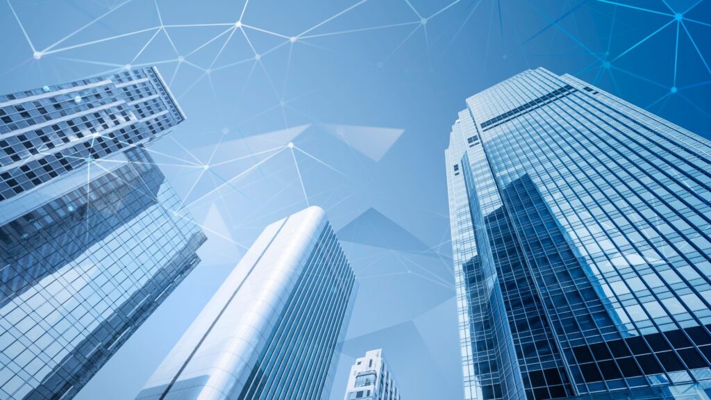 High-rise building with a network of technology dots connecting in an overlay of opacity, symbolizing the intersection of finance, technology, and business growth, representing Owl Rock Technology Income Corp.'s investment focus on high-growth tech companies.